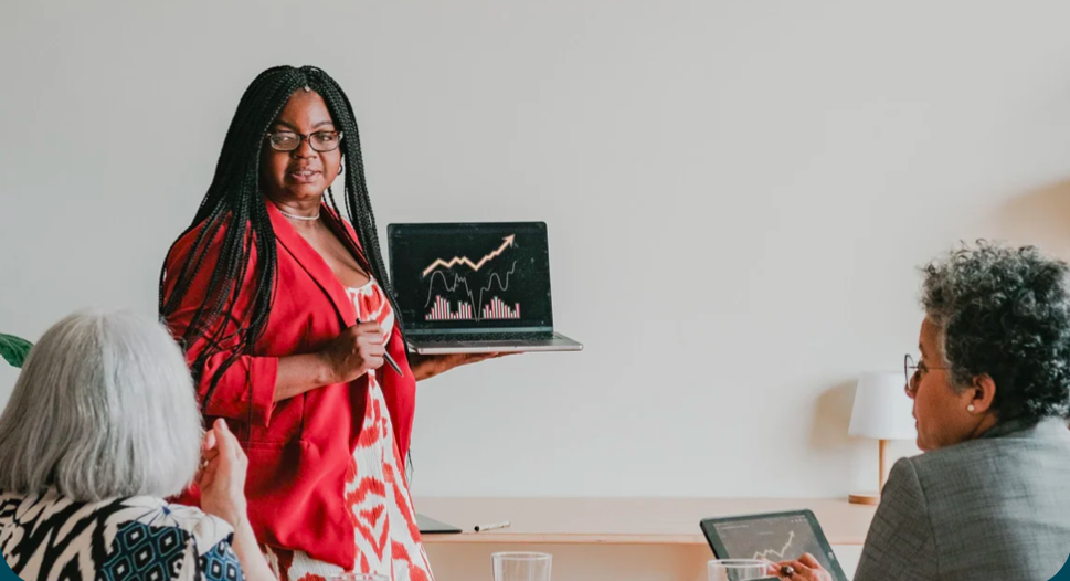 Woman presenting marketing information on a laptop